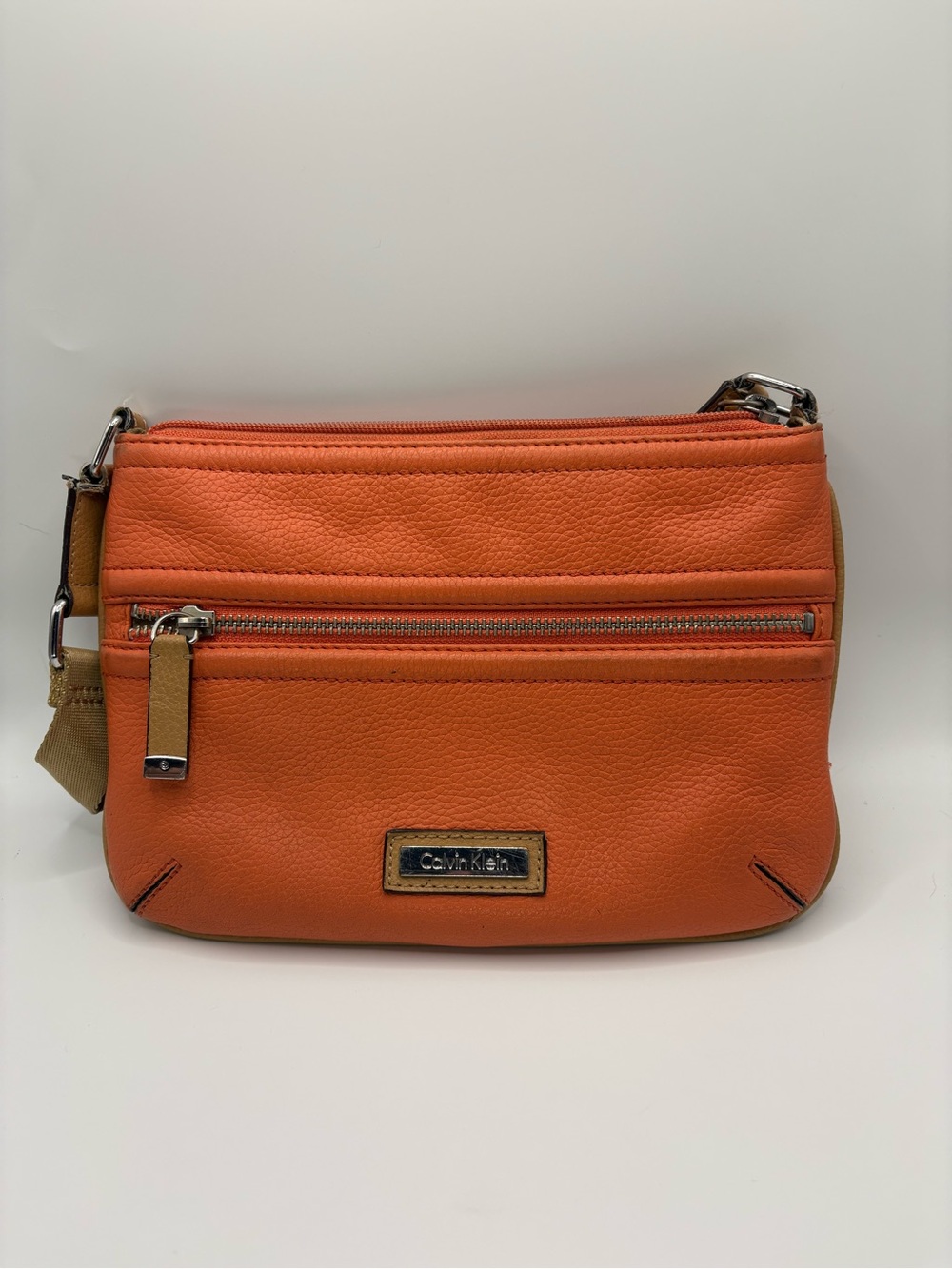 Calvin Klein Orange Pebbled Leather Crossbody Bag with Tan Strap